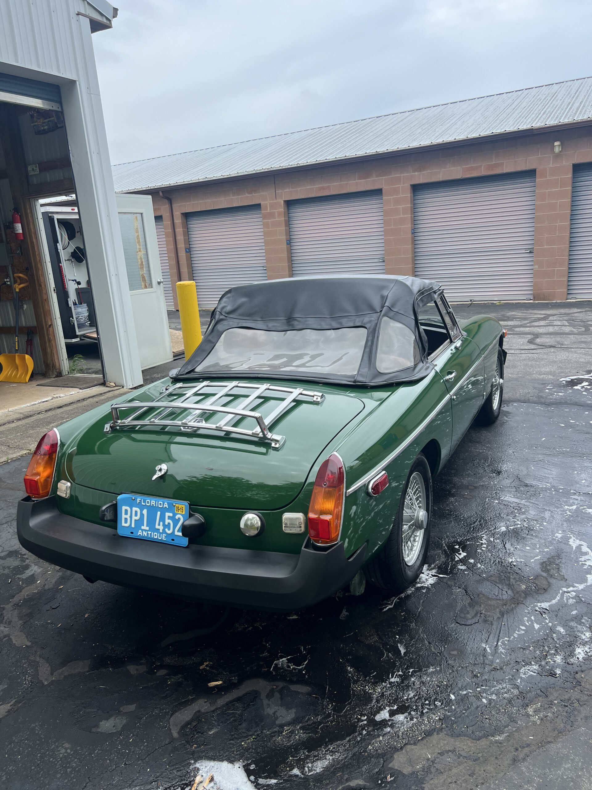 Classic green convertible with a freshly detailed glossy exterior